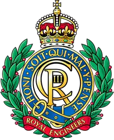 Royal Engineers cap badge: the crowned royal cypher in a Garter circlet and laurel wreath, over a title scroll.