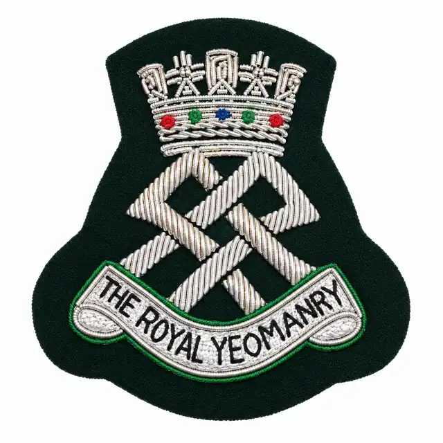 The Royal Yeomanry embroidered cap badge with clean dark green felt and silver bullion embroidery