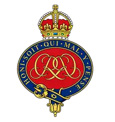Grenadier Guards blazer badge: royal cypher within the blue Garter beneath a crown.