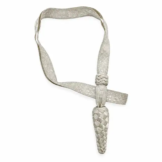 Royal Irish Regiment silver officer sword knot with flat shamrock-pattern lace, silver runner and tapered silver acorn