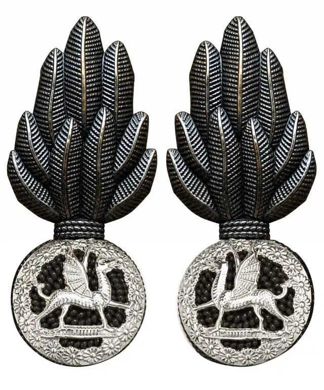 The Royal Welsh officers Service Dress collar badges, dark bronze with silver wreaths and inward-facing dragons